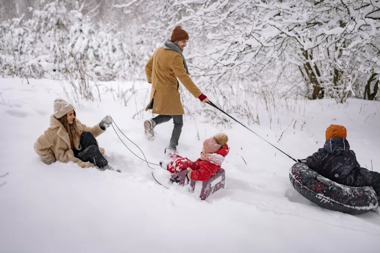 a family having fun playing in the snow